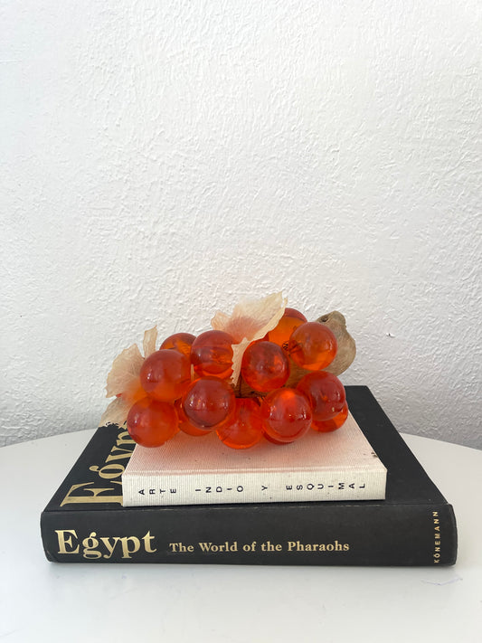 Vintage orange lucite grape cluster on wood stem