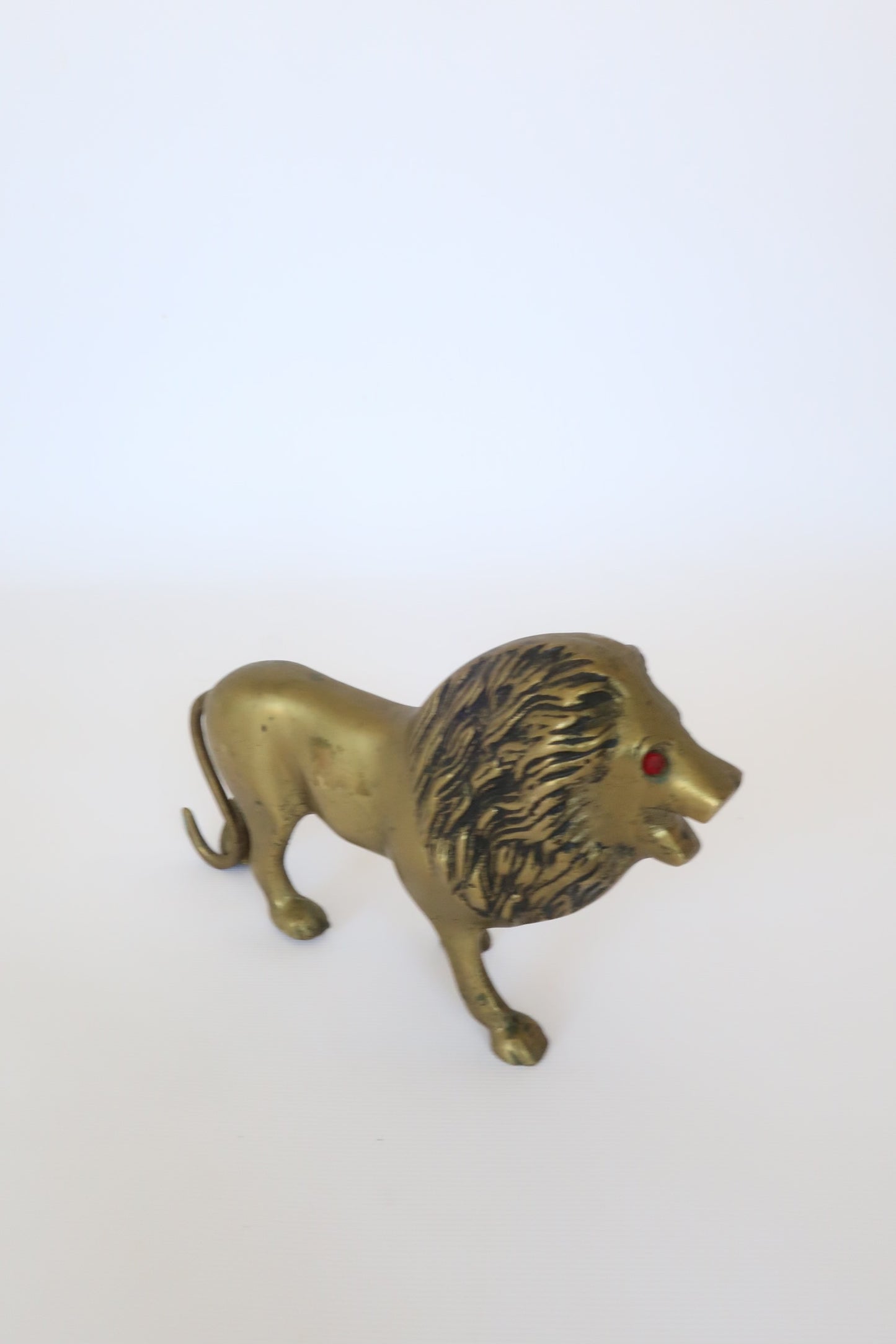 MCM brass lion sculpture w/ ruby red eyes