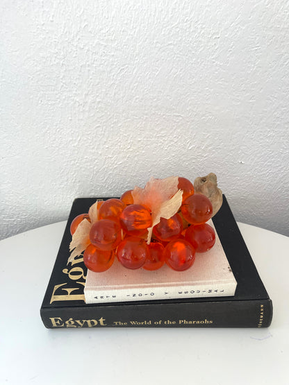 Vintage orange lucite grape cluster on wood stem