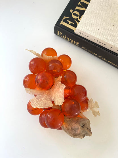 Vintage orange lucite grape cluster on wood stem