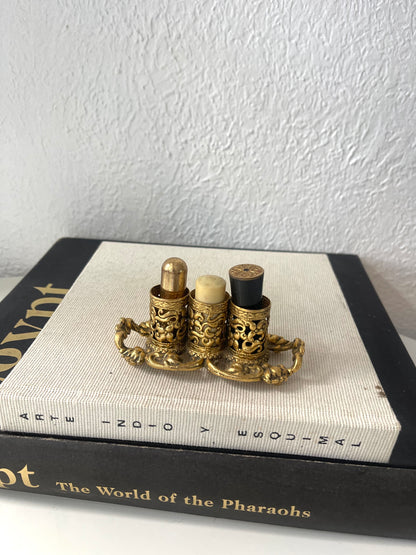 Lavish gold Regency style lipstick holder