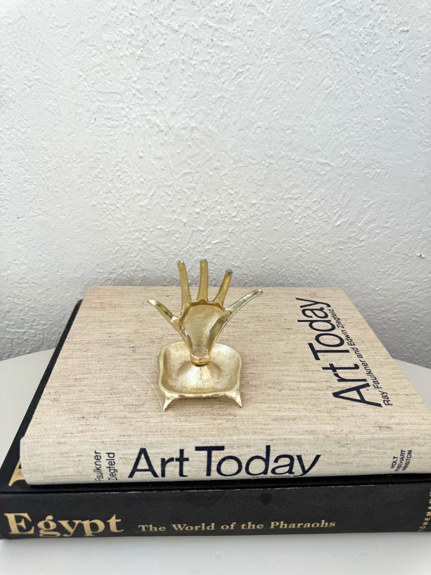 Gold tone metal figural hand ring | jewelry holder on pedestal style base