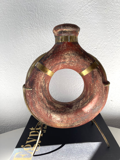 Vintage water jug on metal stand + gold metal finishing