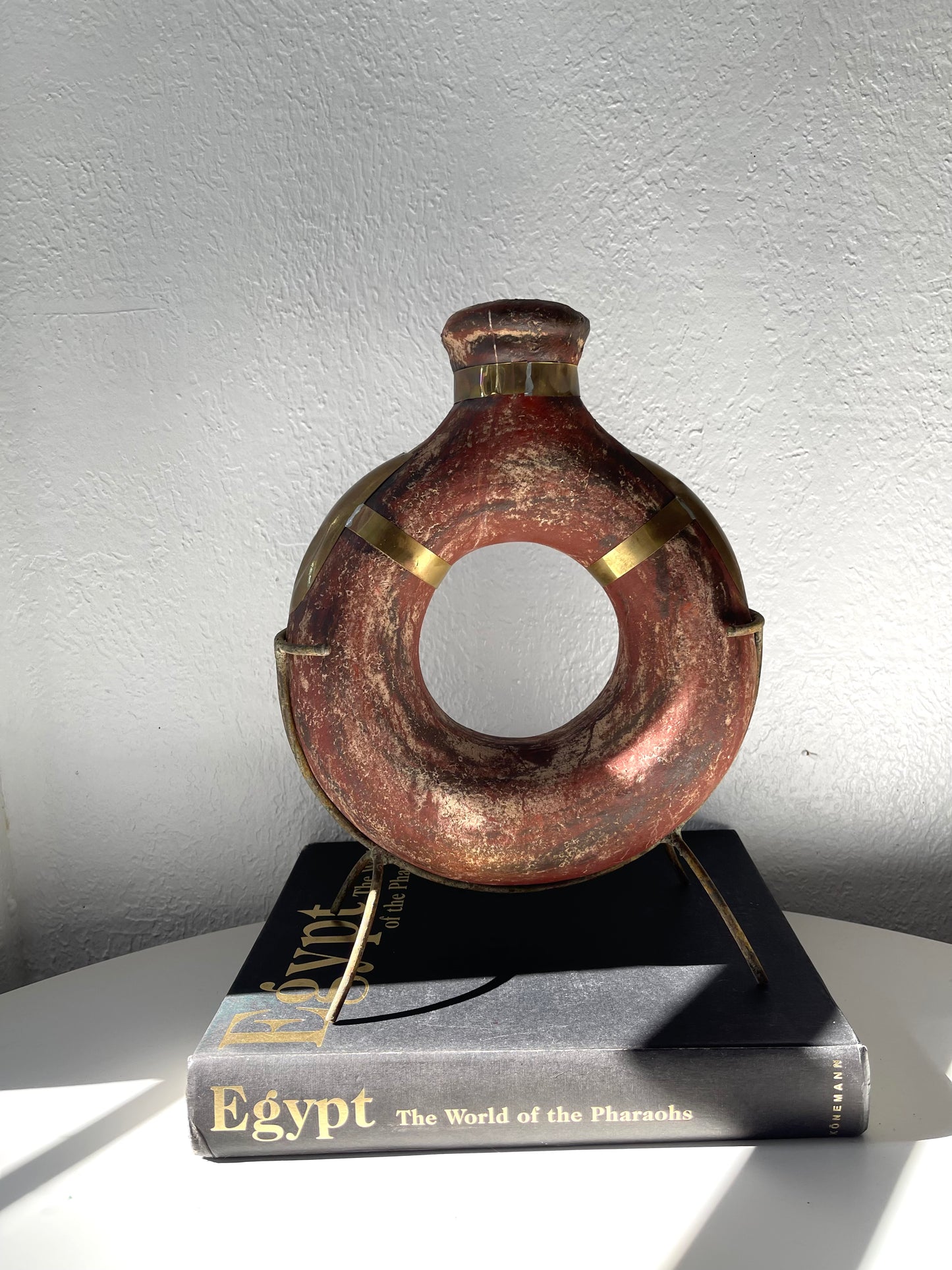 Vintage water jug on metal stand + gold metal finishing